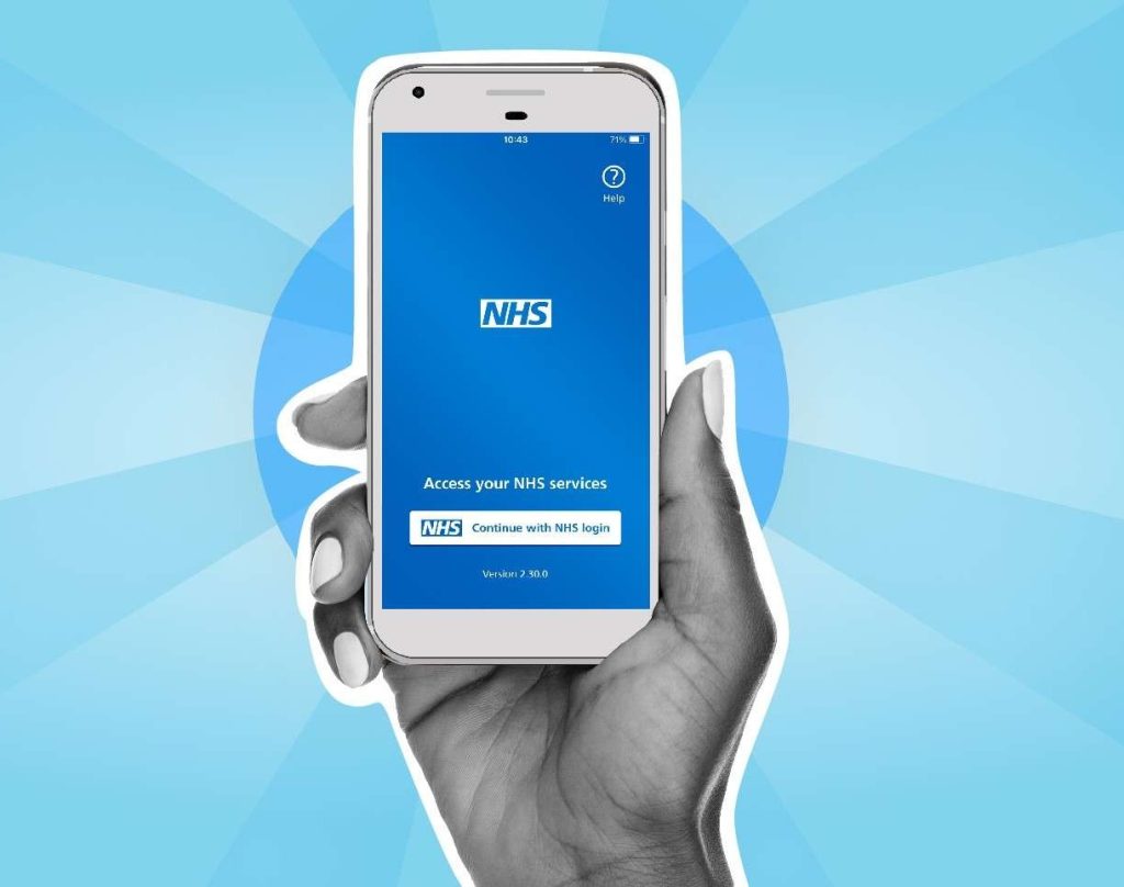 Person holding a smartphone displaying the NHS App home screen as part of the NHS App independent feedback report.